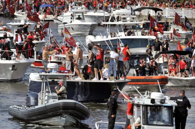 Tom Brady throws Lombardi Trophy over water during Bucs' Super Bowl parade