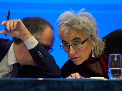 Marion Koopmans, right, and Peter Ben Embarek of a World Health Organization team chat eac