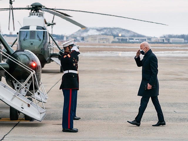 President Joe Biden salutes as he prepares to board Marine One at Joint Base Andrews, Maryland en route to the White House Friday, Feb. 19, 2021, following his trip to Kalamazoo, Michigan. (Official White House Photo by Adam Schultz)