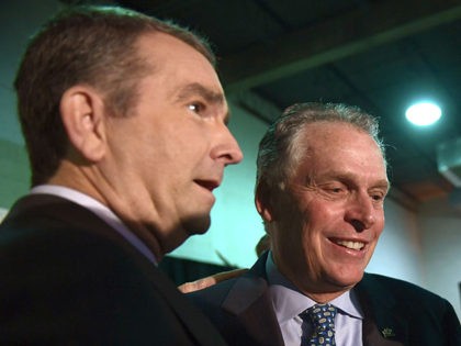 Virginia Gov. Ralph Northam, left, talks with former Virginia Gov. Terry McAuliffe, right, before the start of a news conference in the Crystal City neighborhood in Arlington, Va., Tuesday, Nov. 13, 2018. Amazon, which has grown too big for its Seattle hometown, said it will split its much-anticipated second headquarters …