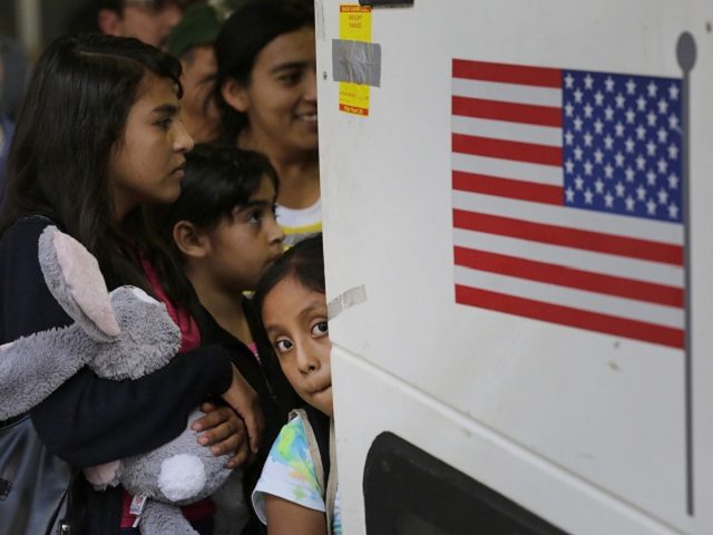 FILE - In this July 7, 2015 file photo, immigrants from El Salvador and Guatemala who entered the country illegally board a bus after they were released from a family detention center in San Antonio. Attorneys on Friday, Aug. 30, 2019, asked a judge to reject Trump administration plans to …