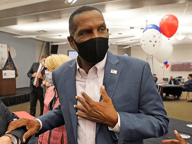 Burgess Owens, Republican candidate in Utah's 4th Congressional District, speaks with peop