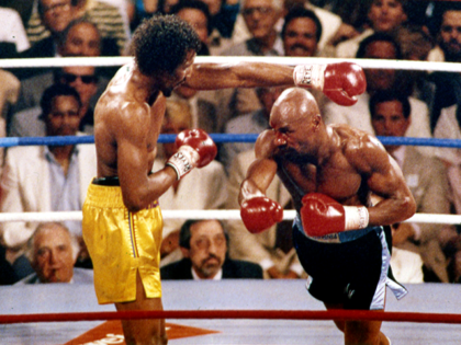 In this April 1985 file photo, Marvin Hagler, right, and Thomas Hearns fight during the first round of a world championship boxing bout in Las Vegas. Hagler, the middleweight boxing great whose title reign and career ended with a split-decision loss to “Sugar” Ray Leonard in 1987, died Saturday, March …