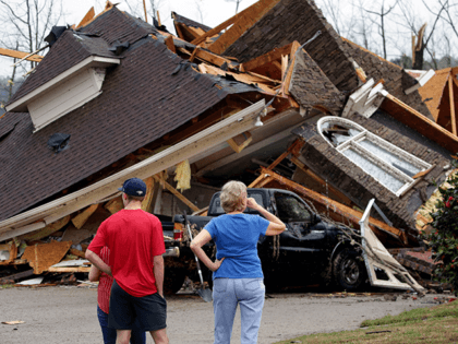 Residents survey damage to homes after a tornado touched down south of Birmingham, Ala. in the Eagle Point community damaging multiple homes, Thursday, March 25, 2021. Authorities reported major tornado damage Thursday south of Birmingham as strong storms moved through the state. The governor issued an emergency declaration as meteorologists …