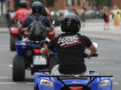 In this file photo, three men drive ATVs in the city center on July 6, 2009 in Berlin, Ger