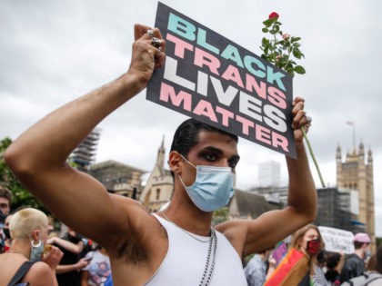 LONDON, ENGLAND - JUNE 27: A Black Trans Lives Matter demonstrator holds a placard in Parl