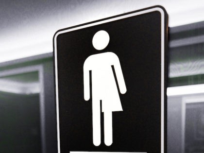 Gender neutral signs are posted in the 21C Museum Hotel public restrooms on May 10, 2016 i