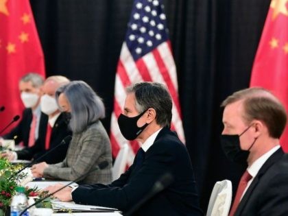 The US delegation led by Secretary of State Antony Blinken (C), flanked by US National Security Advisor Jake Sullivan (R), face their Chinese counterparts at the opening session of US-China talks at the Captain Cook Hotel in Anchorage, Alaska on March 18, 2021. (Photo by Frederic J. Brown/AFP via Getty …
