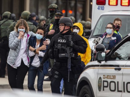 Healthcare workers walk out of a King Sooper's Grocery store after a gunman opened fire on March 22, 2021 in Boulder, Colorado. (Chet Strange/Getty Images)