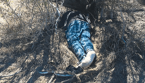 Brooks County deputies recover the body of a recently deceased migrant male on a ranch in February. (Photo: Brooks County Sheriff's Office/Deputy Jose Lemus)