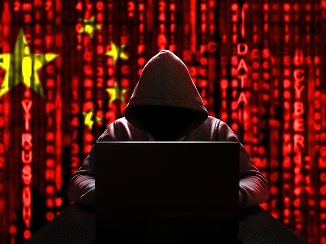 Cyber threat from china. Chinese hacker at the computer, on a background of binary code, t