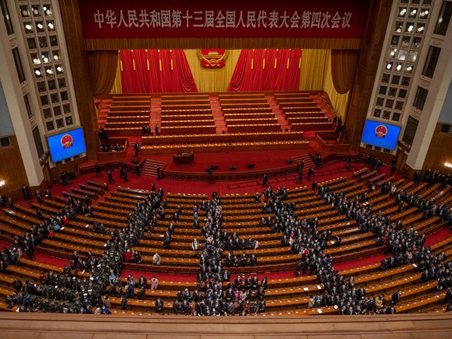 BEIJING, CHINA - MARCH 08: Delegates and lawmakers leave after the second plenary session of the National People's Congress at the Great Hall of the People on March 8, 2021 in Beijing, China. The annual political gatherings of the National Peoples Congress and the Chinese People's Political Consultative Conference, known as the Two Sessions, brings together Chinas leadership and lawmakers to set the blueprint for the coming year. It is considered the most important event on the governments calendar and offers a rare glimpse at what President Xi Jinping and top officials see as priorities. With the pandemic largely under control in China, discussions this year are expected to signal Beijings intentions around technology competition, control over Hong Kong, and strategic threats posed by Western countries including the United States. The political meetings, held at the Great Hall of the People at the edge of Tiananmen Square in central Beijing, can typically last for up to two weeks. (Photo by Kevin Frayer/Getty Images)
