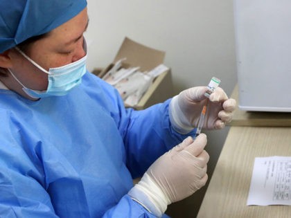 A medical worker prepares to administer a does of Covid-19 coronavirus vaccine at a community health center in Nantong, in eastern China's Jiangsu province on March 2, 2021. (Photo by STR / AFP) / China OUT (Photo by STR/AFP via Getty Images)