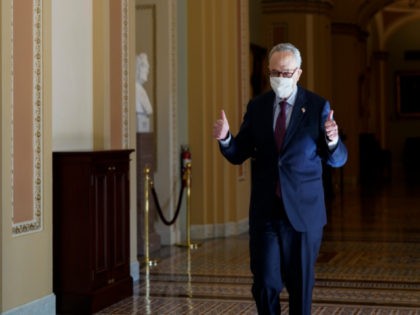 Senate Majority Leader Chuck Schumer of N.Y., gives a thumbs up after he Senate passed a C