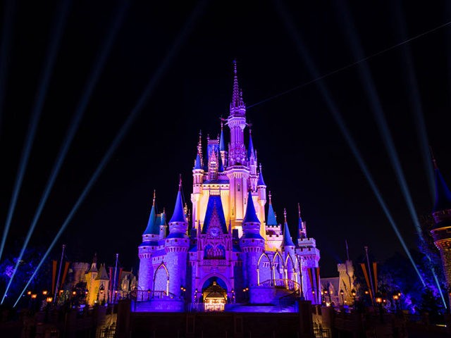 LAKE BUENA VISTA, FL: Cinderella Castle inside the Magic Kingdom Park is lit purple and go
