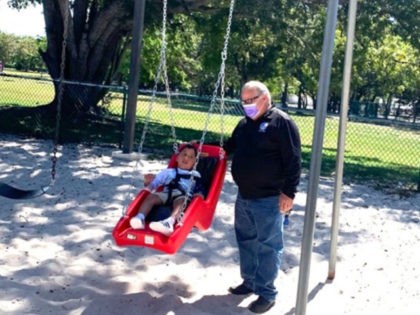 Community Installs Park Swing for Special Needs Boy