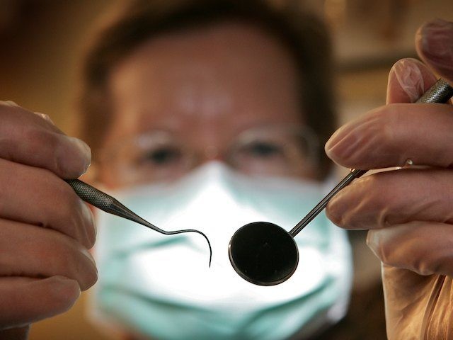 A patient's eye view, as a dentist poses for the photographer on April 19, 2006 in Great B