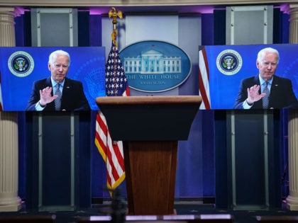 WASHINGTON, DC - FEBRUARY 25: U.S. President Joe Biden is displayed on screens in the White House press briefing room as he addresses the National Governors Association on February 25, 2021 in Washington, DC. (Photo by Drew Angerer/Getty Images)