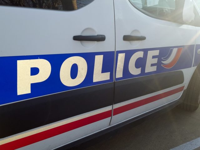 detail of french police car with sun in summer day