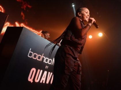 LOS ANGELES, CALIFORNIA - APRIL 10: Saweetie performs onstage at the boohooMAN x Quavo Lau