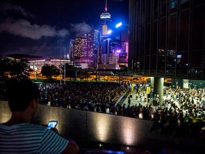 People listen to speeches during an event put on by the Civil Human Rights Front in Hong K