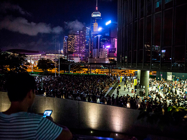 People listen to speeches during an event put on by the Civil Human Rights Front in Hong K
