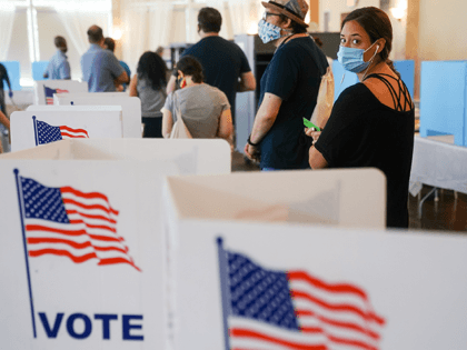 People wait in line to vote in Georgia's Primary Election on June 9, 2020 in Atlanta, Georgia. Voters in Georgia, West Virginia, South Carolina, North Dakota, and Nevada are holding primaries amid the coronavirus pandemic. (Photo by Elijah Nouvelage/Getty Images)