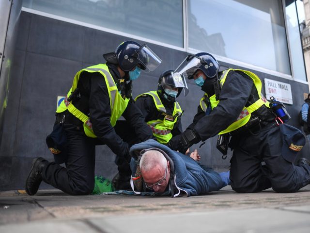LONDON, ENGLAND - NOVEMBER 28: A man is seen being arrested during a protest on November 28, 2020 in London, England. London is to return to 'Tier 2' or 'high alert' covid-19 restrictions once the current England-wide coronavirus lockdown ends next Wednesday. All three of the tiers, assigned to local …