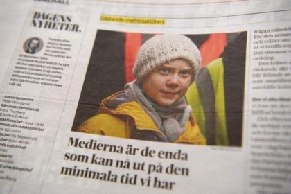 The daily Swedish newspaper Dagens Nyheter is pictured on December 6, 2020 in Stockholm as climate activist Greta Thunberg, 17, is the editor-in-chief for a day. - Of the newspaper's almost one hundred pages, more than half are devoted to the climate crisis. (Photo by Henrik MONTGOMERY / TT News …
