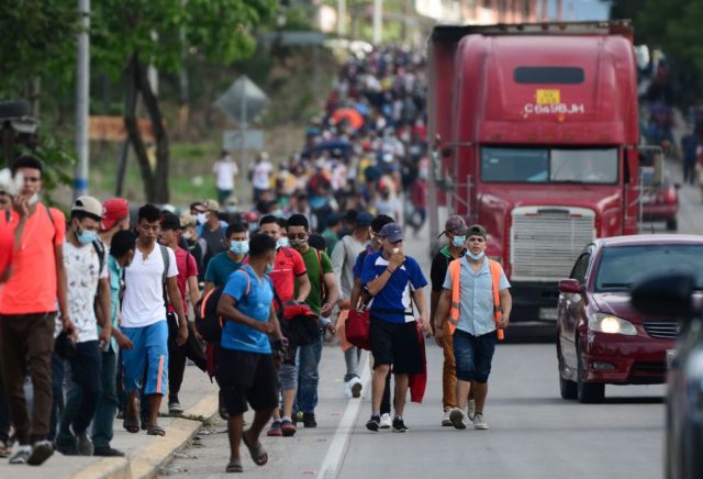 Migrants heading to the border with Guatemala on their way to the United States, march in
