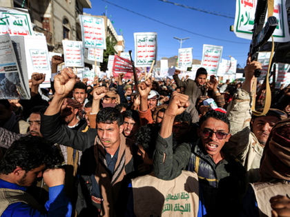 Supporters of Yemen's Huthi rebels attend a rally denouncing the United States and the outgoing Trump administration's decision to apply the "terrorist" designation to the Iran-backed movement, in the Huthi-held capital Sanaa on January 25, 2021. (Photo by Mohammed HUWAIS / AFP) (Photo by MOHAMMED HUWAIS/AFP via Getty Images)