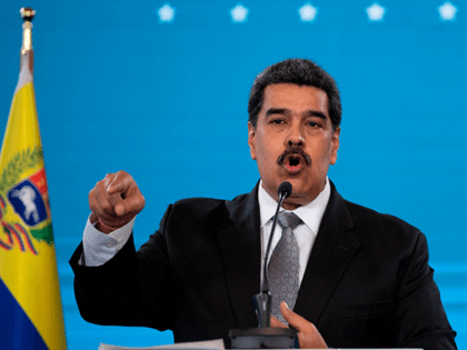 Venezuelan President Nicolas Maduro gestures while speaking during a press conference at M