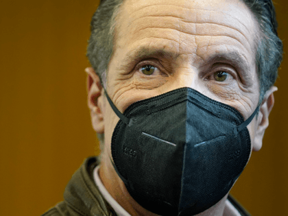 New York Governor Andrew Cuomo walks through a vaccination site after speaking in the Broo