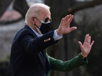 TOPSHOT - US President Joe Biden and First Lady Jill Biden walk to Marine One as they depart from the South Lawn of the White House in Washington, DC on February 26, 2021. - President Biden and First Lady travel to Texas to visit a food bank and emergency operations …