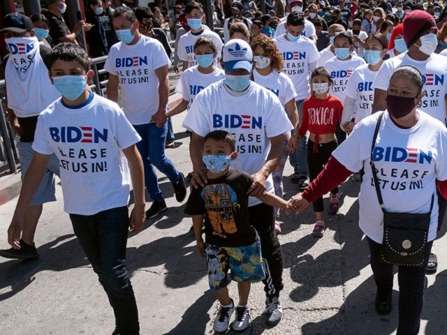 Migrants hold a demonstration demanding clearer United States migration policies, at San Ysidro crossing port in Tijuana, Baja California state, Mexico on March 2, 2021. - Thousands of migrants out of the Migrant Protection Protocol (MPP) program are stranded along the US-Mexico border without knowing when or how they will …