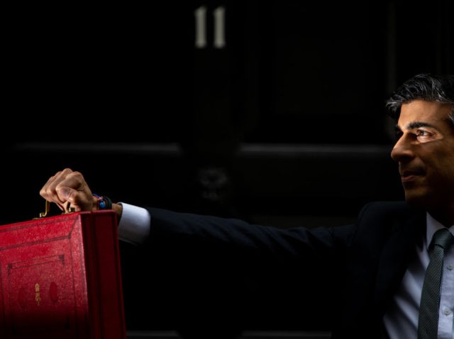 LONDON, ENGLAND - MARCH 03: Chancellor Of The Exchequer, Rishi Sunak stands with the Budge