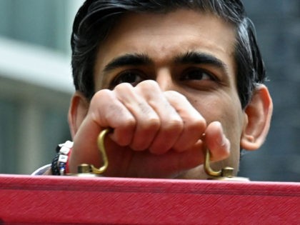 Britain's Chancellor of the Exchequer Rishi Sunak poses with the Budget Box as he leaves 11 Downing Street before presenting the government's annual budget to Parliament in London on March 3, 2021. - British finance minister Rishi Sunak unveils his annual budget today promising measures to safeguard businesses and jobs, …