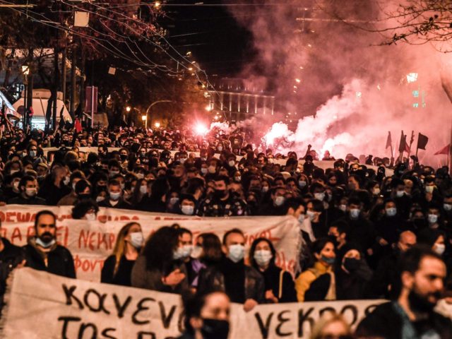 People light flares during a fourth day of demonstrations to support convicted operational