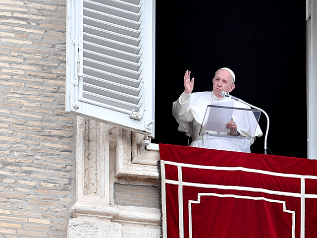 Pope Francis addresses attendees from the window of the apostolic palace overlooking St. P