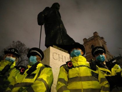 LONDON, ENGLAND - MARCH 14: Police officers surround the statue of Winston Churchill on Parliament Square during a protest criticising the actions of the police at last night's vigil on Parliament Square Garden on March 14, 2021 in London, England. Hundreds of people turned out in Clapham Common on Saturday …