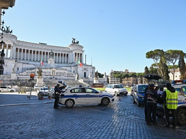 Municipal police control drivers at Piazza Venezia square in central Rome, on March 15, 20