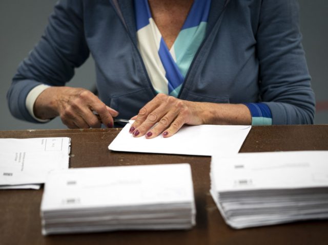 Postal ballots are casted in a sports hall during Netherland's Parliamentary election