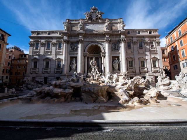 A picture shows the Trevi fountain without water in central Rome on March 15, 2021, after