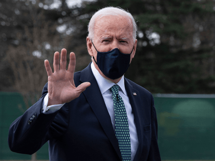 US President Joe Biden gestures as he walks off Marine One upon his arrival at the White House in Washington, DC, on March 17, 2021. (Photo by JIM WATSON / AFP) (Photo by JIM WATSON/AFP via Getty Images)