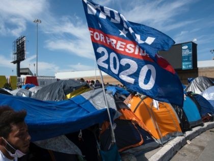 A US President Joe Biden campaign flag is seen at a migrants camp where asylum seekers wai