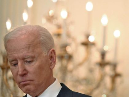 US President Joe Biden pauses during his first press briefing in the East Room of the Whit