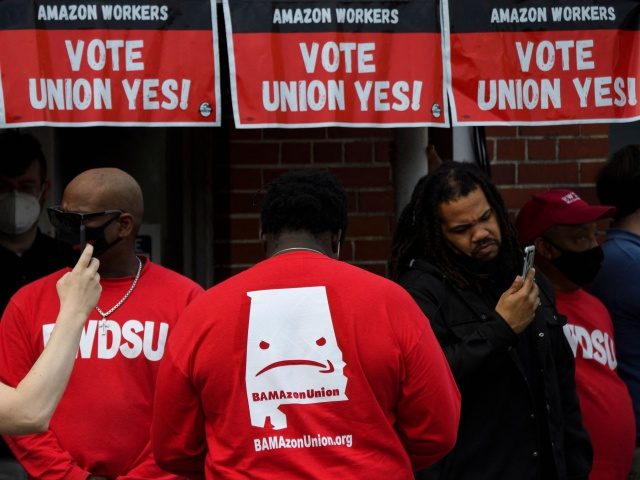 Organizers wear shirts in support of the unionization of Amazon.com, Inc. fulfillment cent