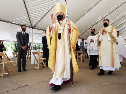 LOS ANGELES, CALIFORNIA - AUGUST 08: Archbishop José H. Gomez (C) departs the first-ever outdoor Ordination Mass at the Cathedral of Our Lady of the Angels amid the COVID-19 pandemic on August 8, 2020 in Los Angeles, California. Archbishop Gomez ordained eight new priests, known as the ‘Pandemic Class of …