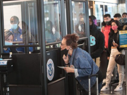 CHICAGO, ILLINOIS - OCTOBER 19: A Transportation Security Administration (TSA) agent screens an airline passenger at O'Hare International Airport on October 19, 2020 in Chicago, Illinois. Yesterday the TSA reported that it had screened over 1 million passengers, representing the highest number of passengers screened at TSA checkpoints since March …