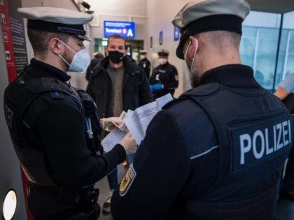 FRANKFURT AM MAIN, GERMANY - JANUARY 28: Border police check passengers arriving on a flight from Spain to be sure they can show evidence of a recent COVID-19 test at Frankfurt Airport during the second wave of the coronavirus pandemic on January 28, 2021 in Frankfurt, Germany. German Interior Minister …